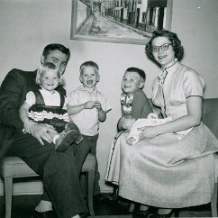 1958 Christmas in Michigan, while Tod pursued a Master’s degree. Married six years with four children. Newborn Lynn is on Jackie’s lap.