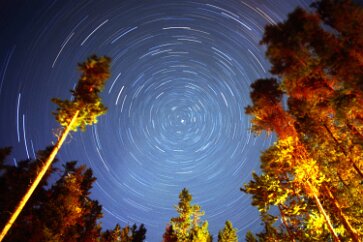 Banff Poles While camping trips make great venues for photographing the sky, sometimes it is difficult to get a full view of it. But here is an opening in the canopy, the...