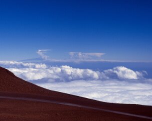 Haleakala Clouds It is an unnerving experience to be looking down at the clouds. In this view the color of the sky seems exaggerated, but it is our proximity to space that gives...