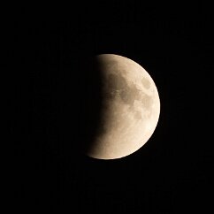 Half Eclipse We can see the curvature of the Earth as the moon enters its shadow. The color in the shadow is a coppery red, but it is a thousandth of the brightness of the...