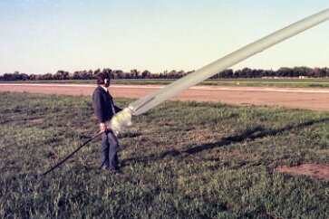 19770500 Balloon Launch T11-23 Helium is injected via a filler tube into the bubble of the balloon. It is a noisy process.