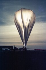 19770500 Balloon Launch T11-25 Ready for launch. The helium tank truck is to the left, the long tail of the balloon runs to the right.