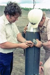 DownholeMagnetometer-4 Steve and Jack adjust a guide wheel, intended to help the probe stay in close contact with the edge of the borehole.