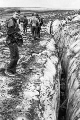 19700800-GrinnellGlacierHike-6 My dad, age 37, stands near a crevasse. We are protected against rain by a garbage bag with arm holes, and tennis shoes were the best footwear we could muster....