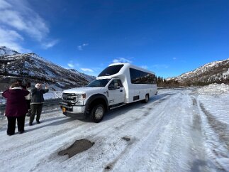 IMG_3669 On the road. Our group of 14 fit in this specialized van- big windows, including one in the front that gave us a large view of the high mountains all around us.