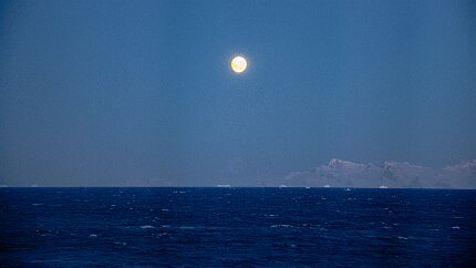 IMG_2450 This is the darkest it will get tonight. The sun is 9-degrees below the horizon, but the full moon is 15-degrees up and illuminates distant icebergs and...