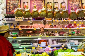 Baloney in Balogna. The large cylinders behind the butcher's head are 