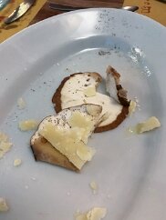 Food-115 Porcini, boletus edulis, the remnants of fresh raw porcini mushrooms with Parmesan shavings and seasoning.