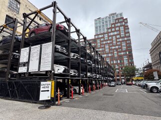 IMG_6640 A parking lot with stacked cars. Check out their rates!