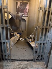 IMG_5824 The jail is a cylinder that rotates in order to access a cell. The gear that drives it can be seen just under the floor.